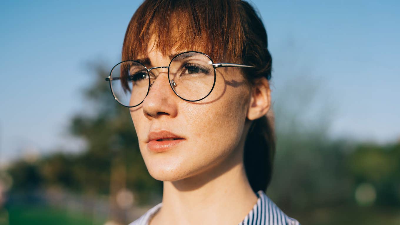 Woman looking concerned thinking about signs from the universe. 