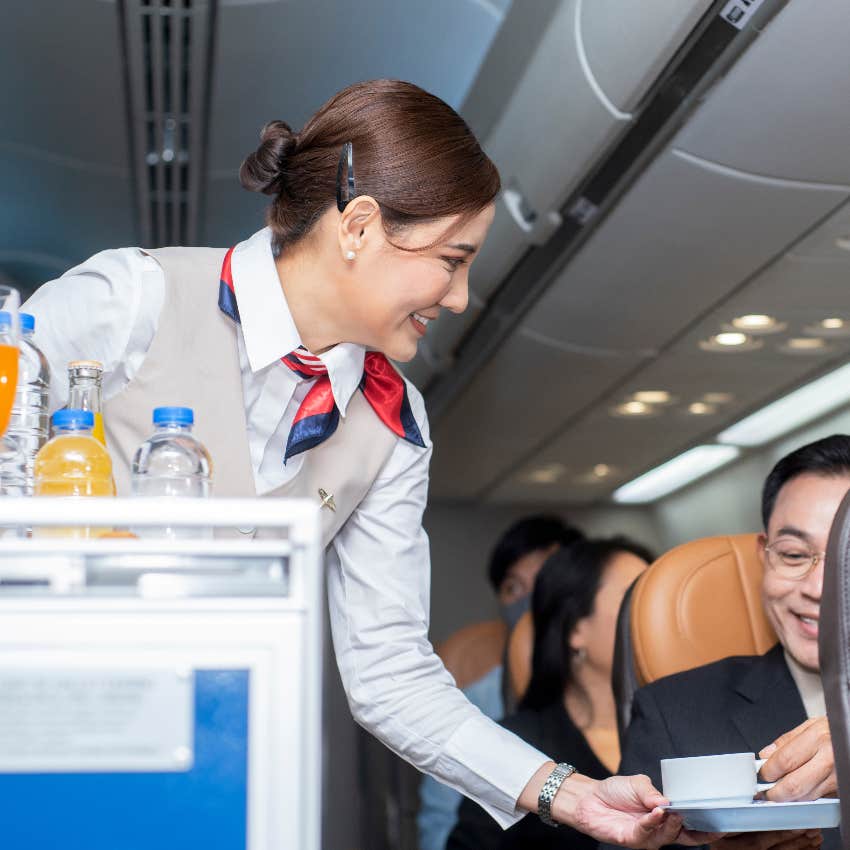 Flight attendant serving drinks