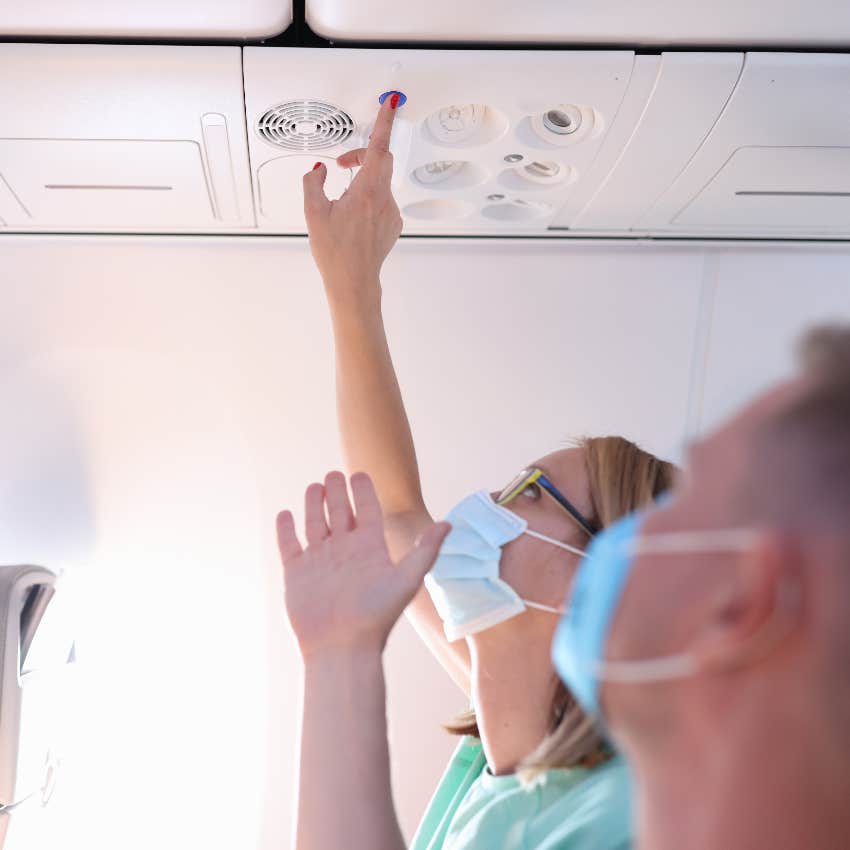 Flight passenger hitting the call button