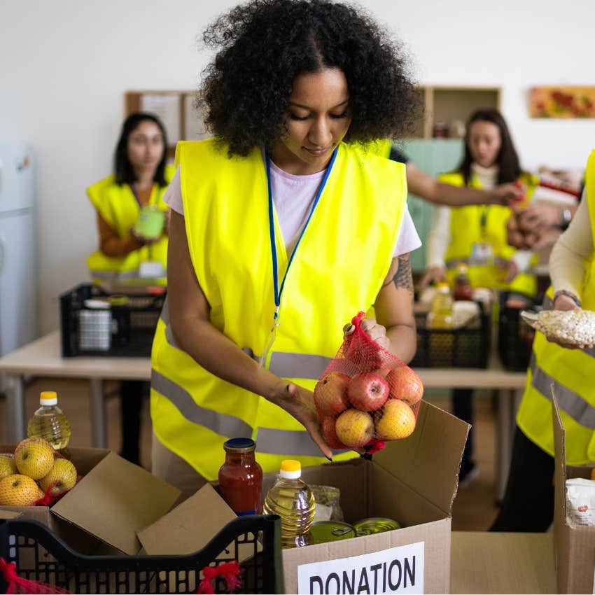 Food drive workers packing food into boxes. 