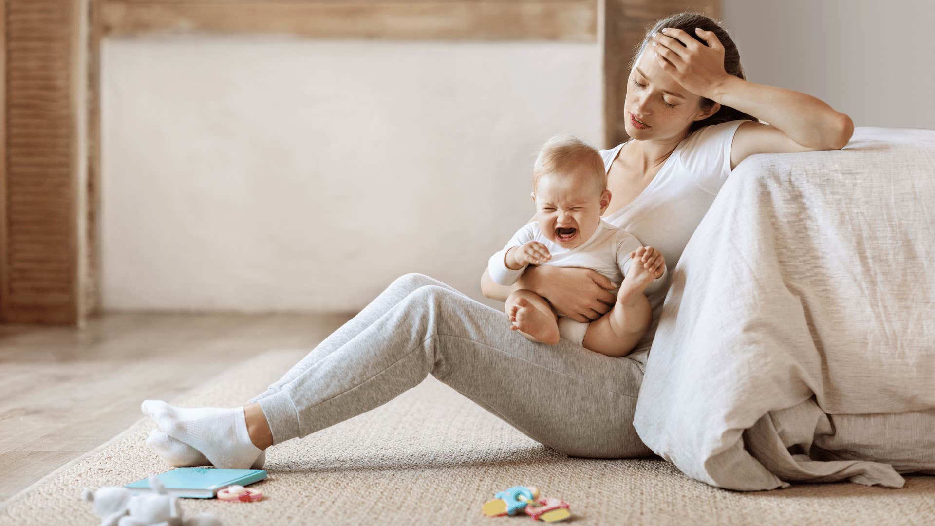 tired mom with crying baby