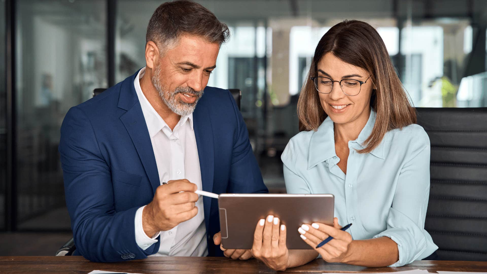 woman and man collaborating at work