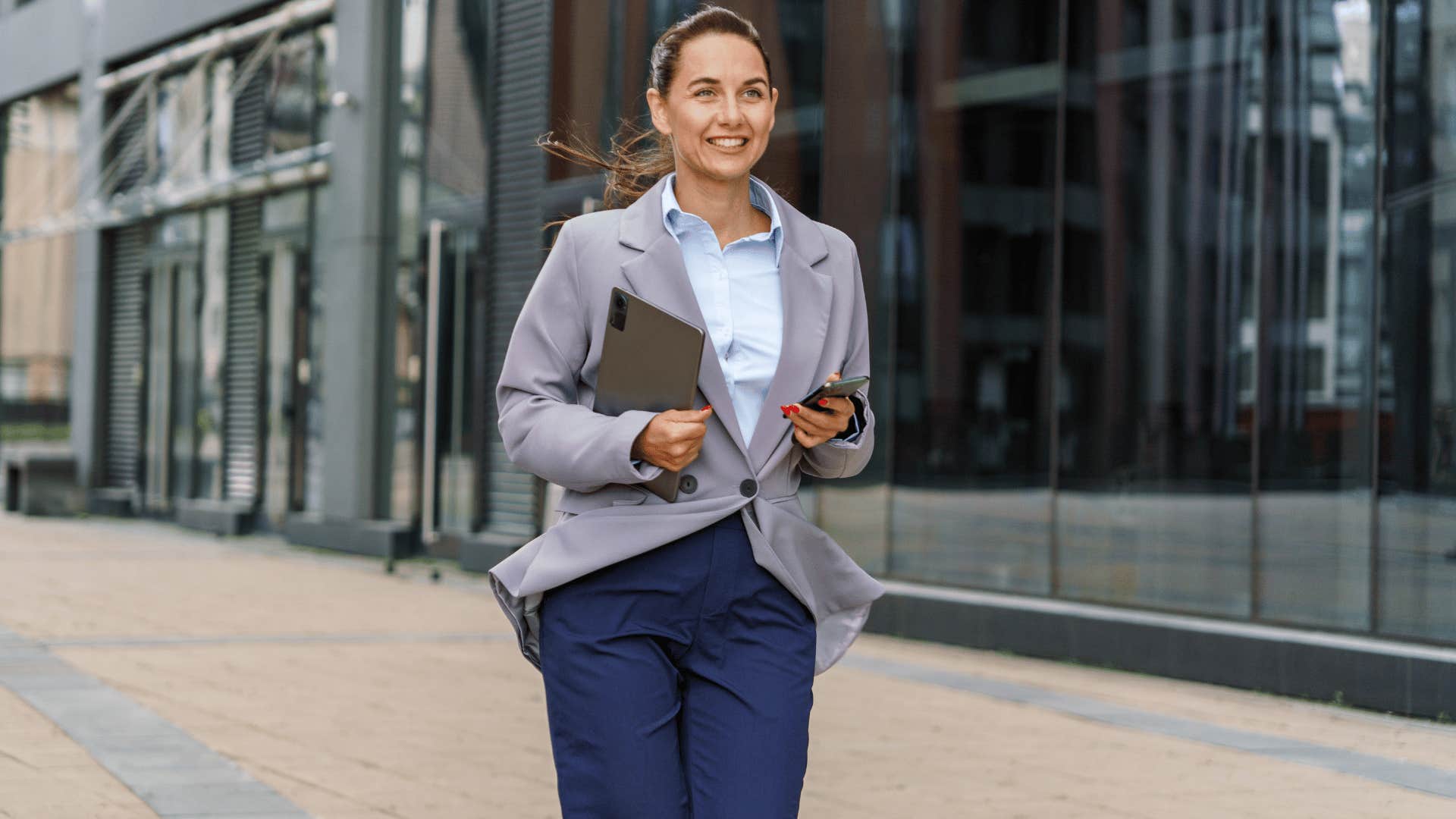 woman walking to work looking professional 