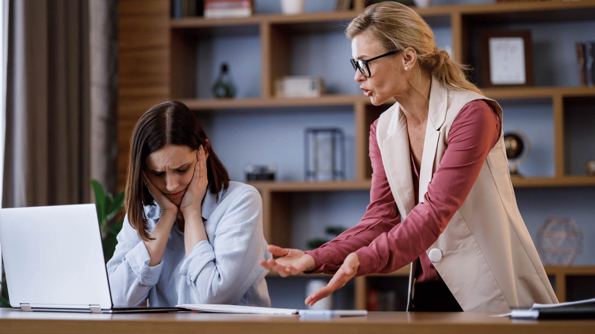 woman scolding employee