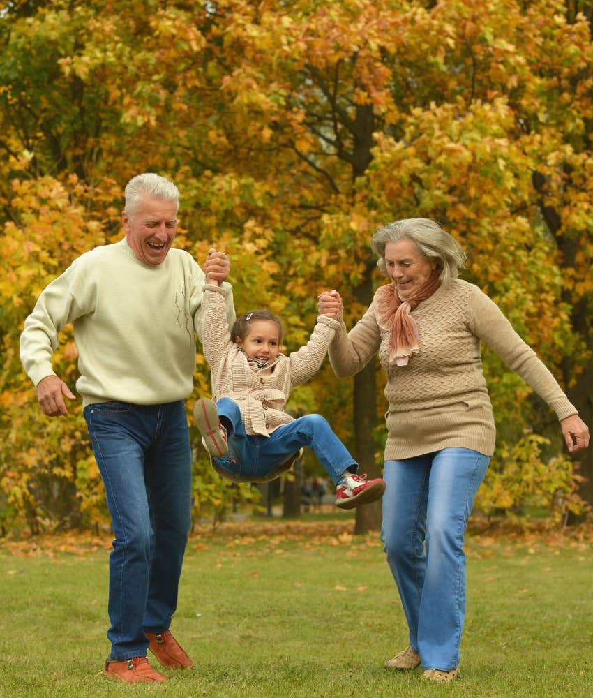 grandparents playing with granddaughter