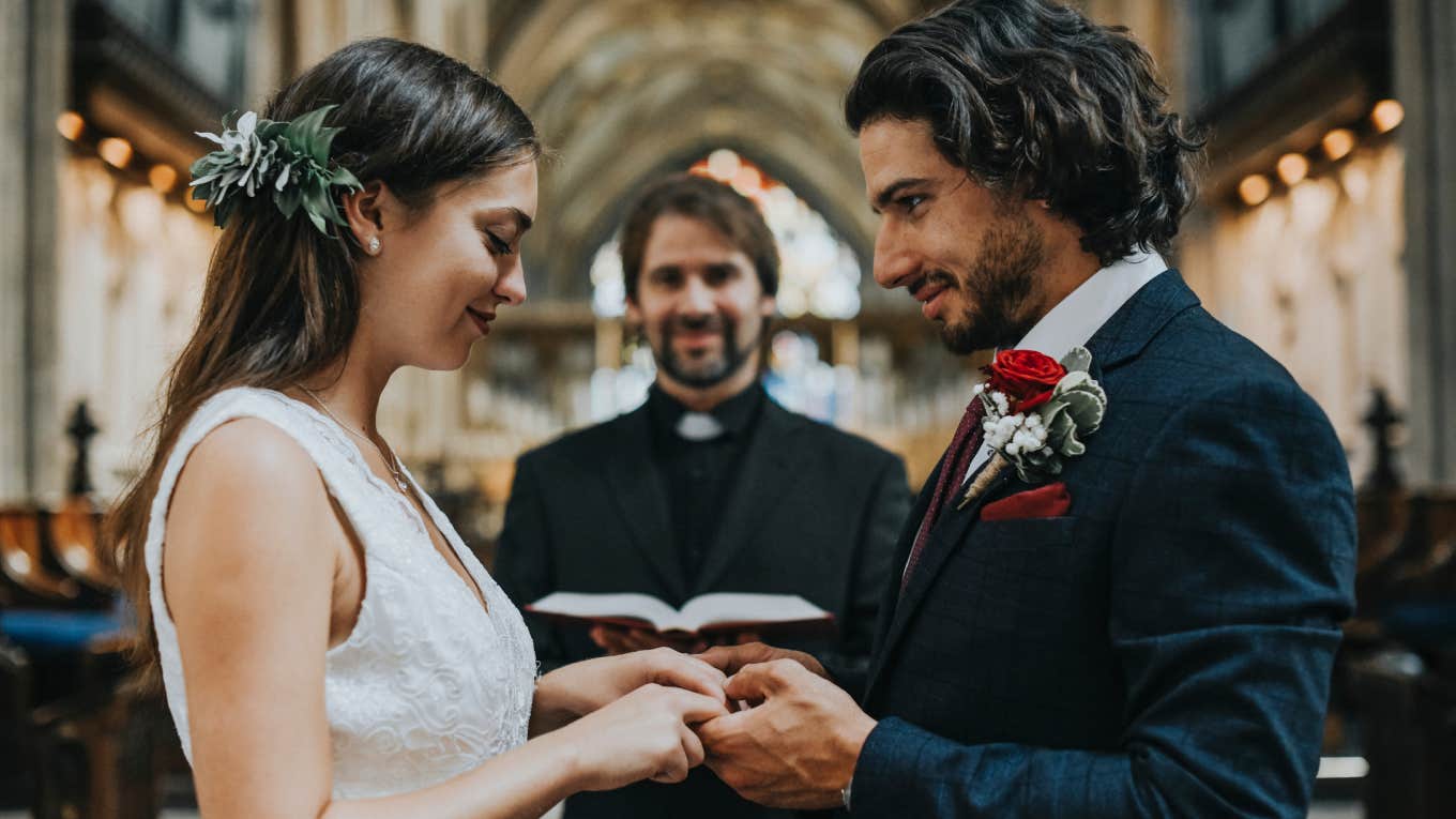 bride and groom at the altar holding hands