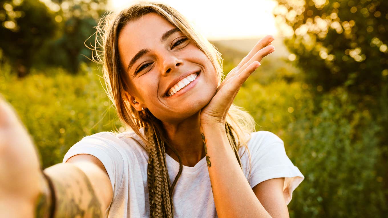 Happy woman smiling, dramatically changing life.