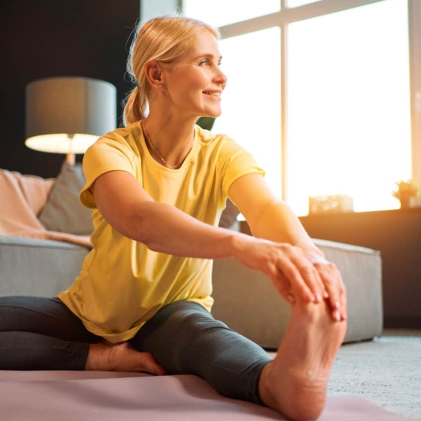 happy middle-aged woman doing yoga