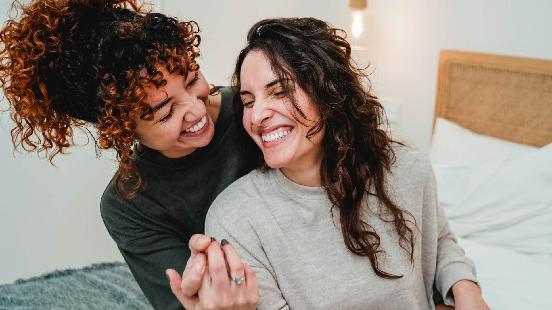 Mother and narcissistic adult child hugging and smiling.