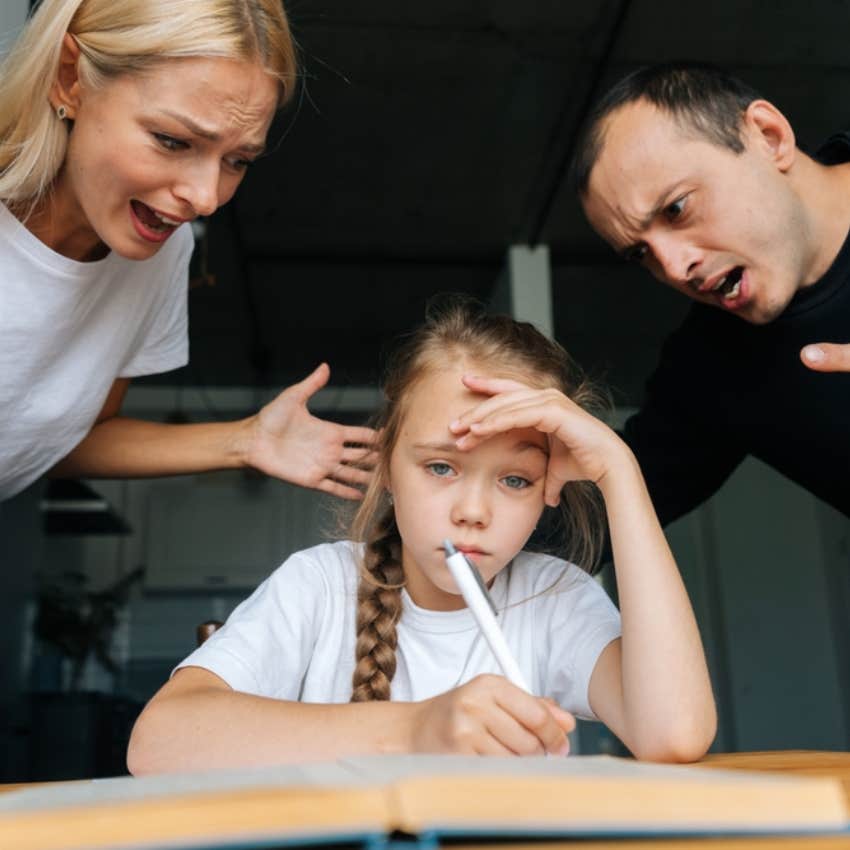 stressed little girl doing homework