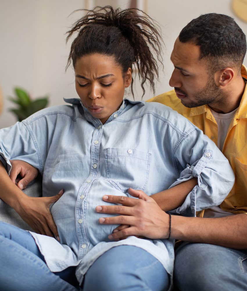 husband supporting his wife in labor