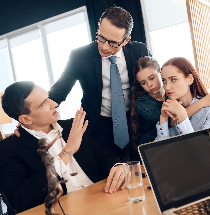 Divorce mediator stand between couple and child