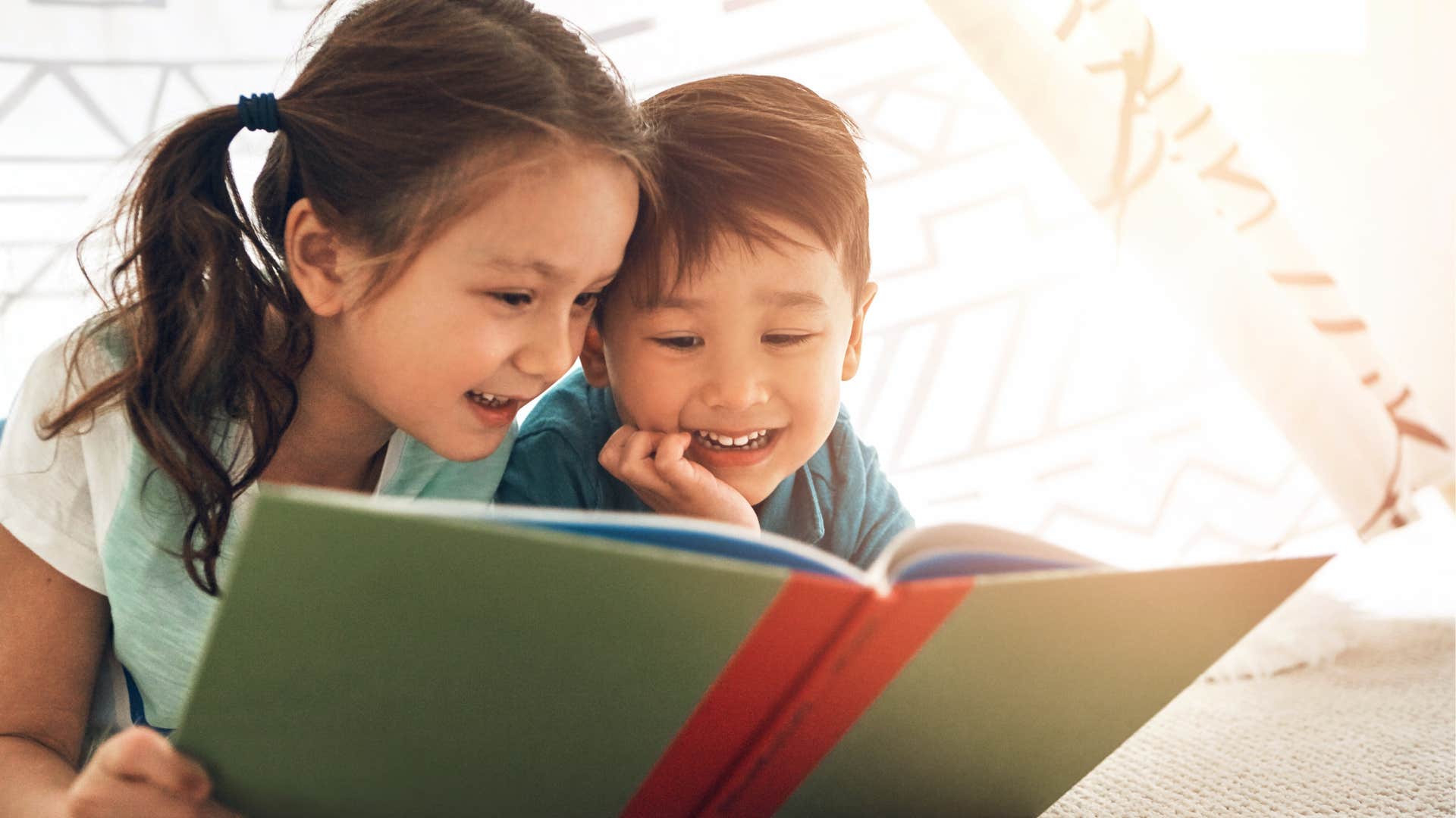 Kids home alone reading together.