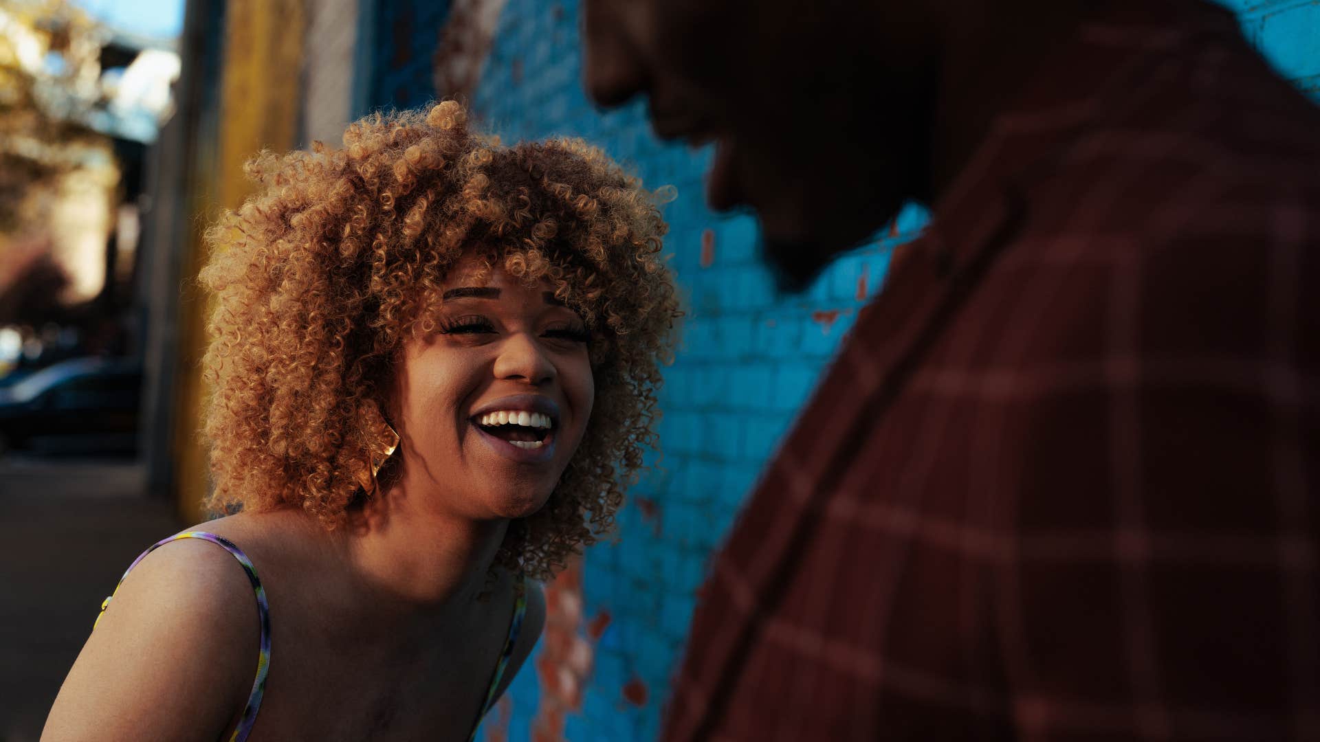 Woman smiling at her husband.