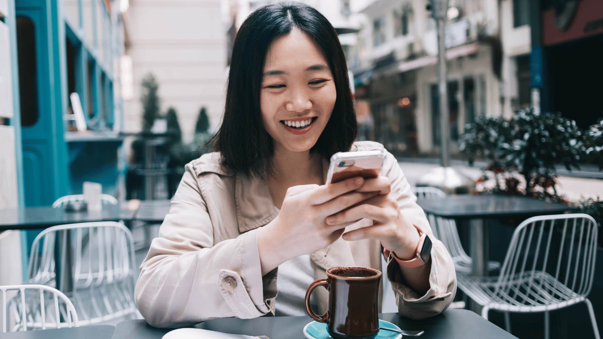 woman texting while sitting down