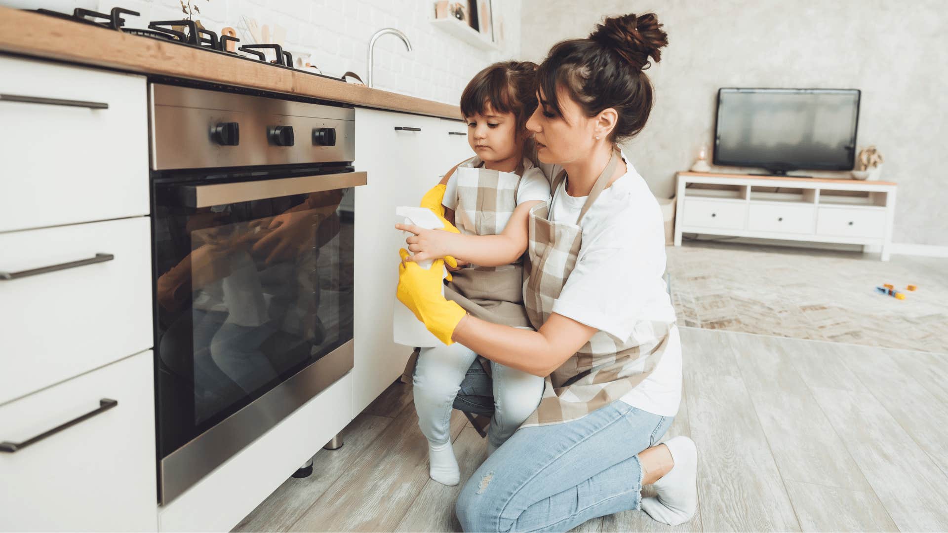 mom cleaning with her toddler