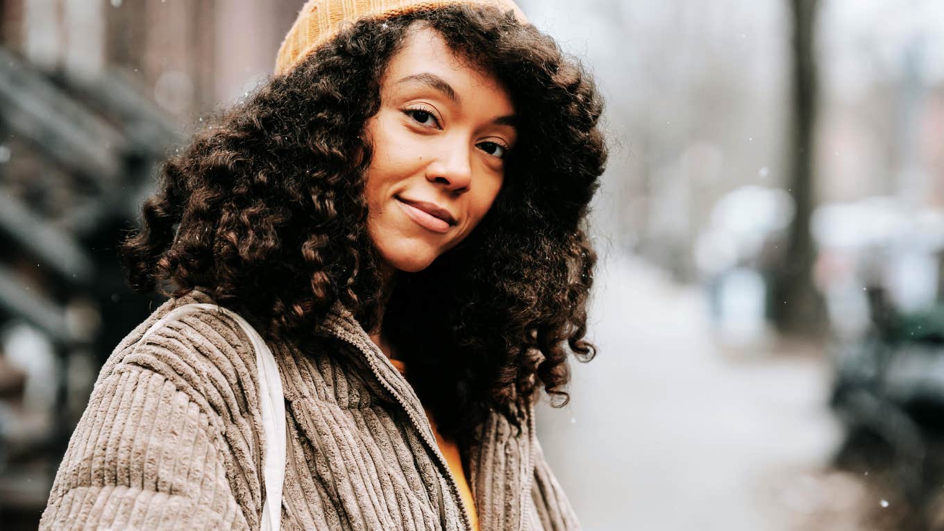 Courageous and strong woman standing on street