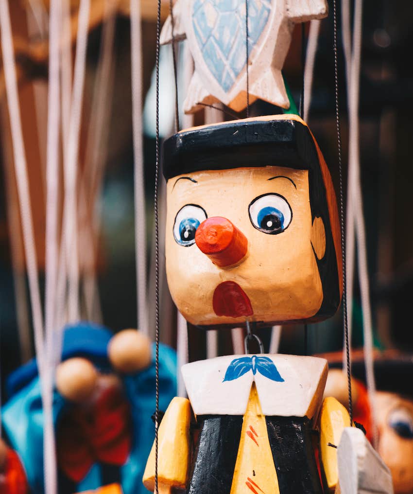 Pinocchio Puppet hangs on display