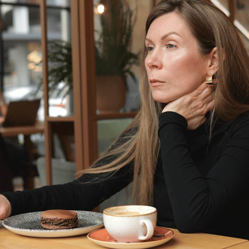 lonely middle aged woman in a cafe