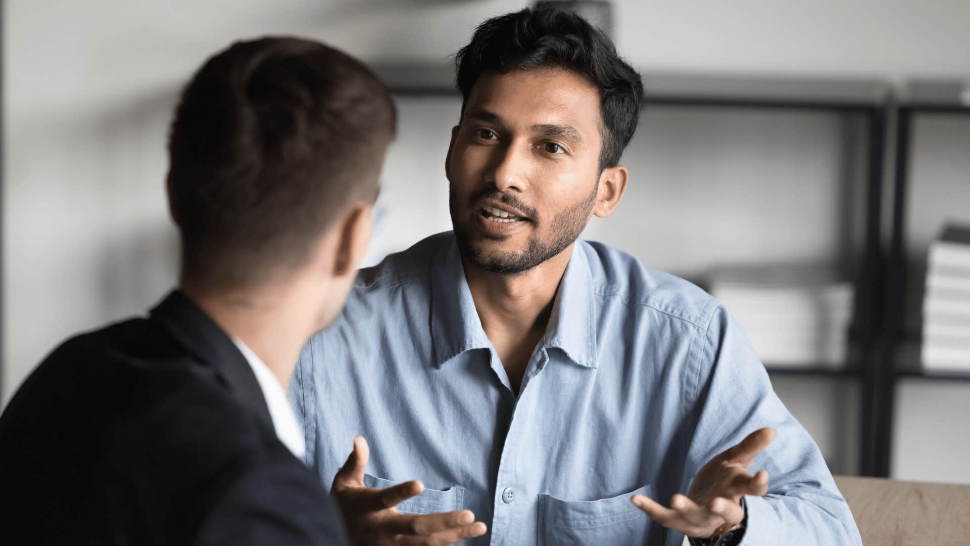 men talking in an office