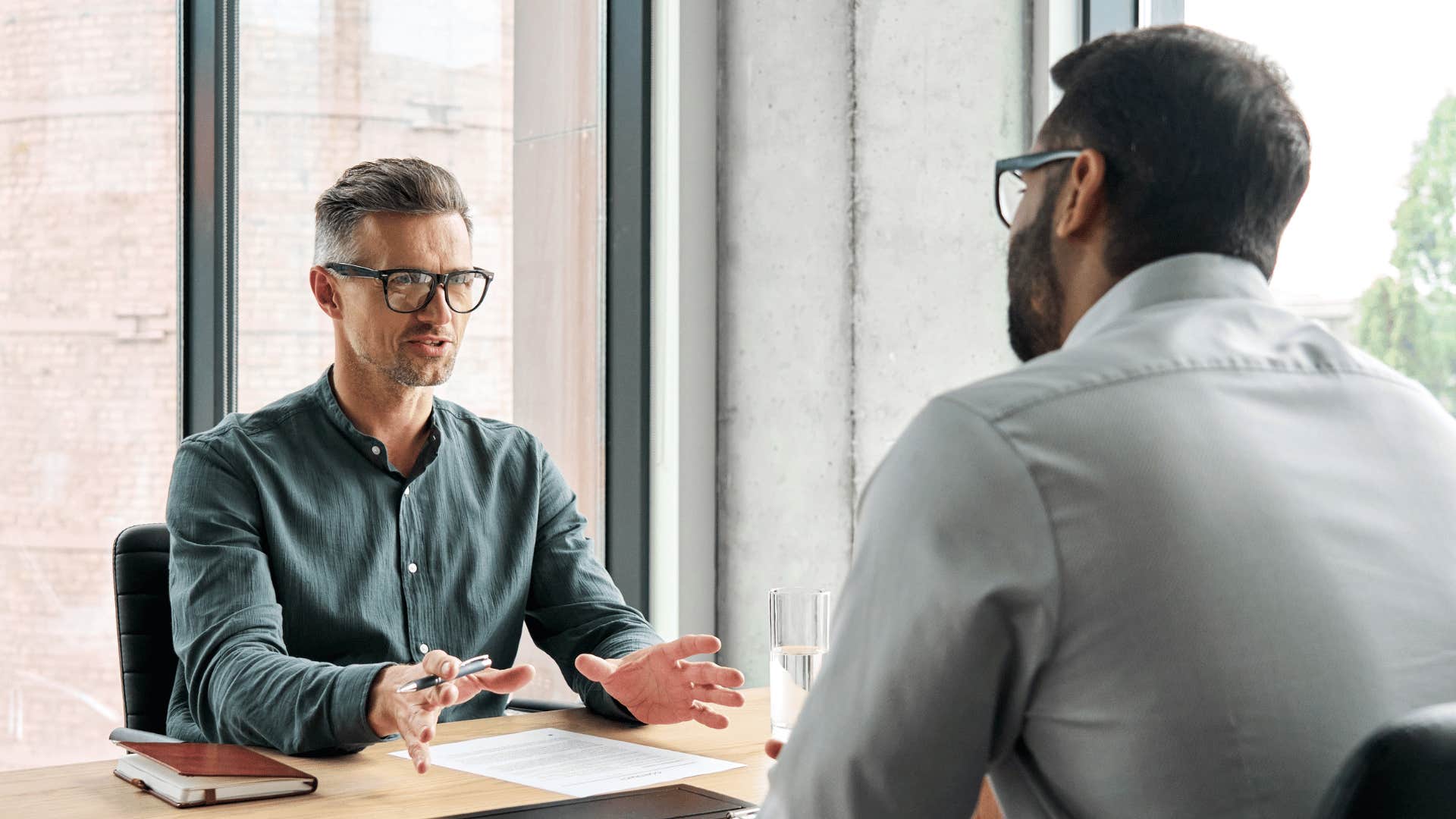 two men in a meeting