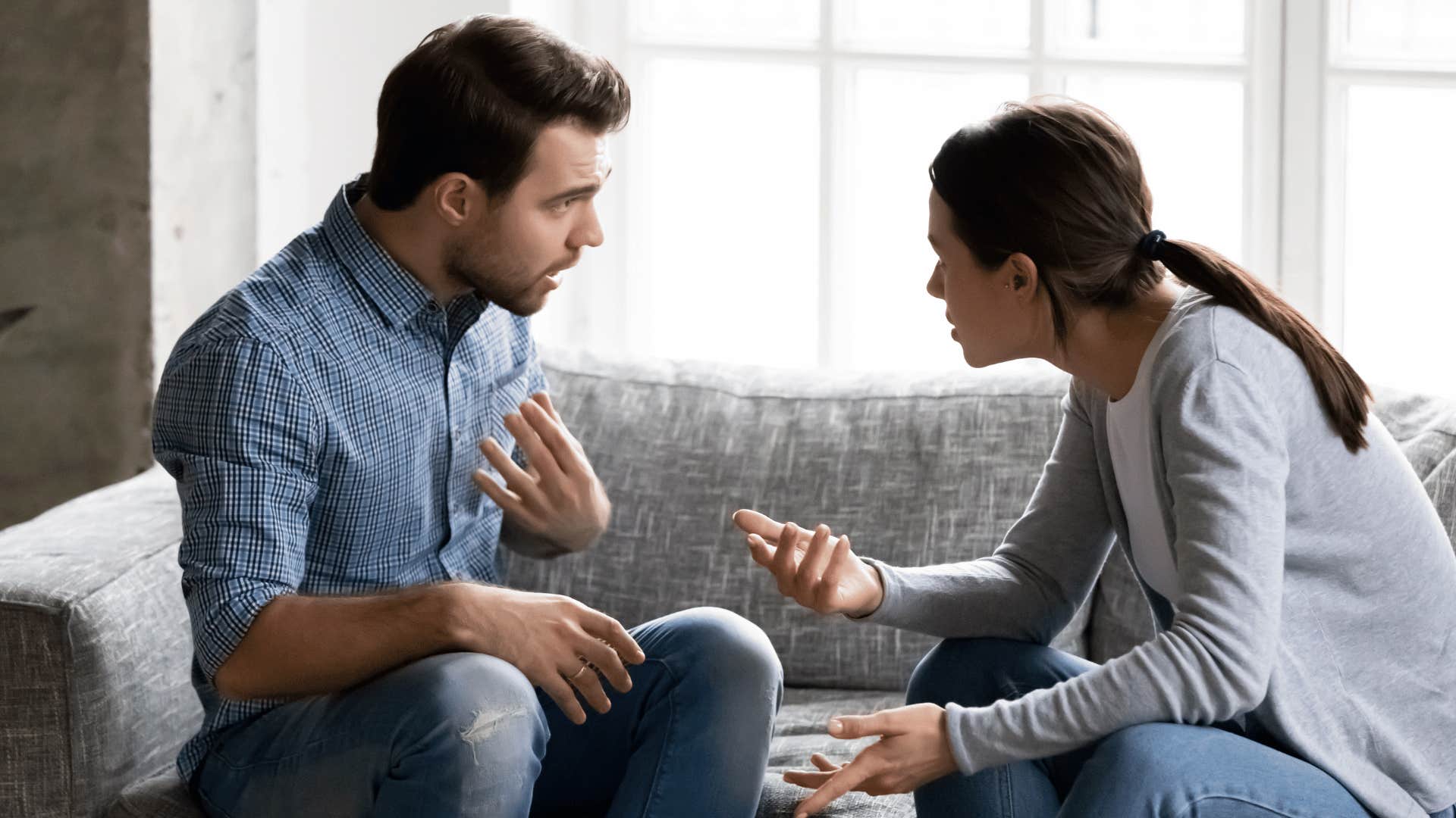 man and woman sitting together