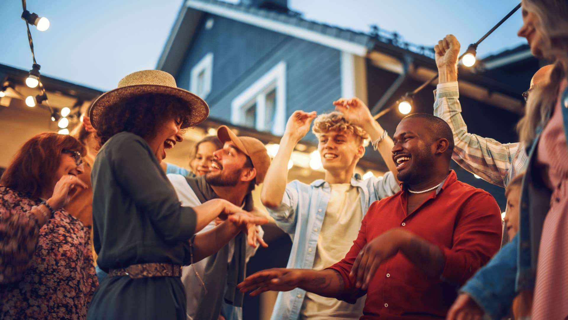 Group of firends dance at backyard party