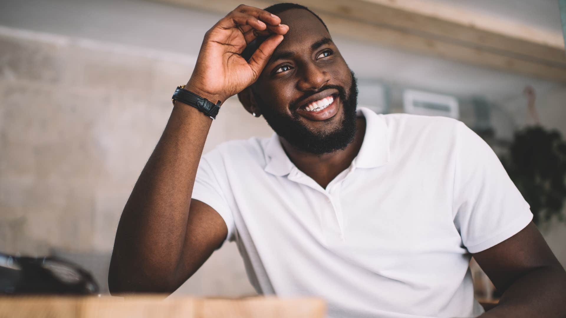 Man looking confident in a white shirt.