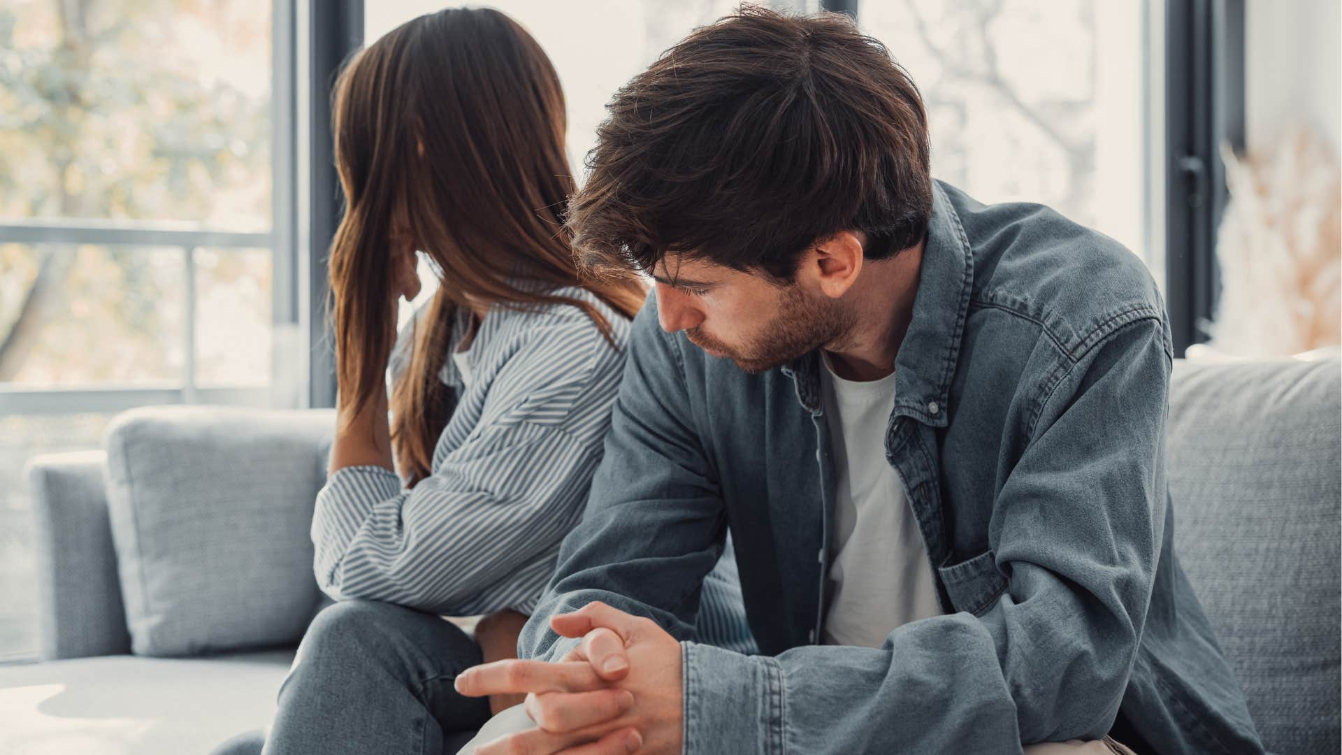 Man looking excluded from conversation