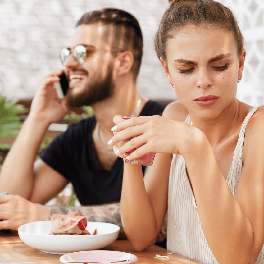 man on phone call ignoring woman