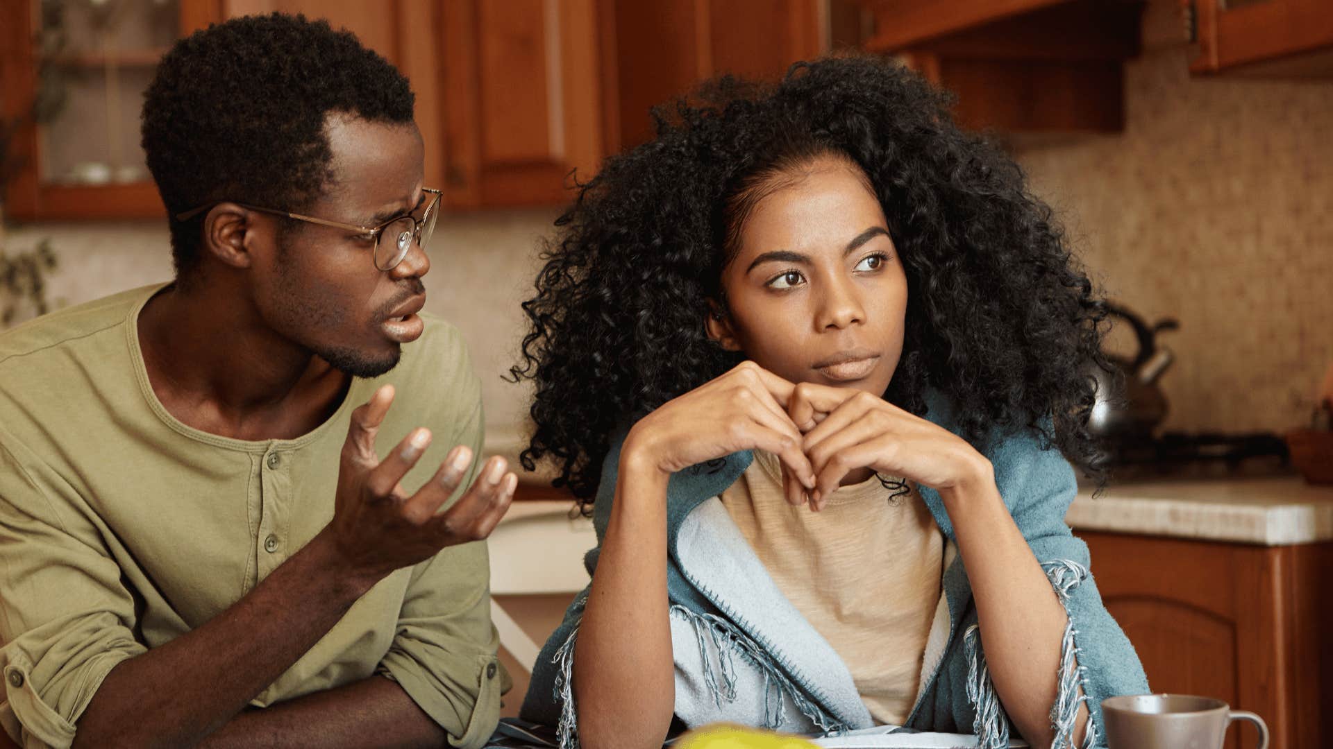 Upset couple, he expresses annoyance, she turns away