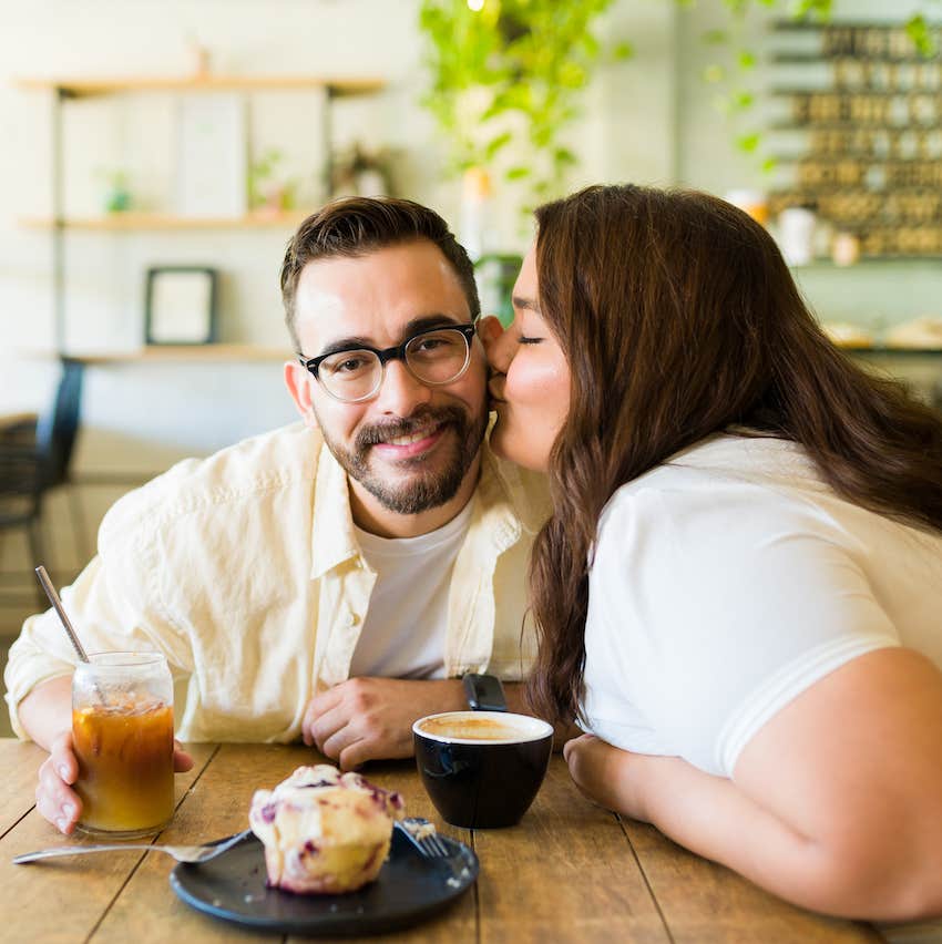 She kisses his cheek over coffee and a muffin