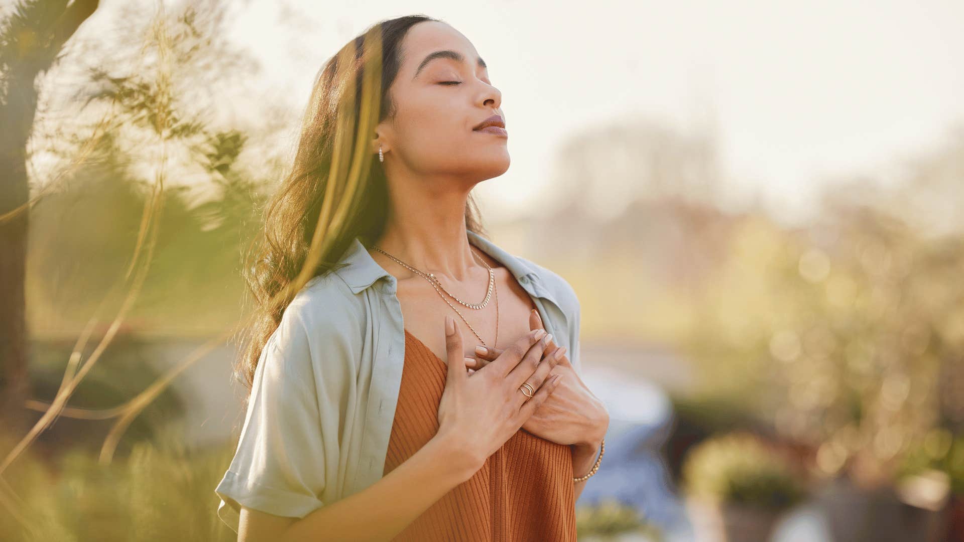 woman meditating outside 