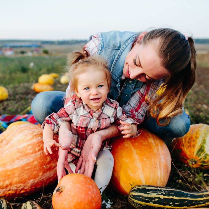 mom and baby at pumpkin patch