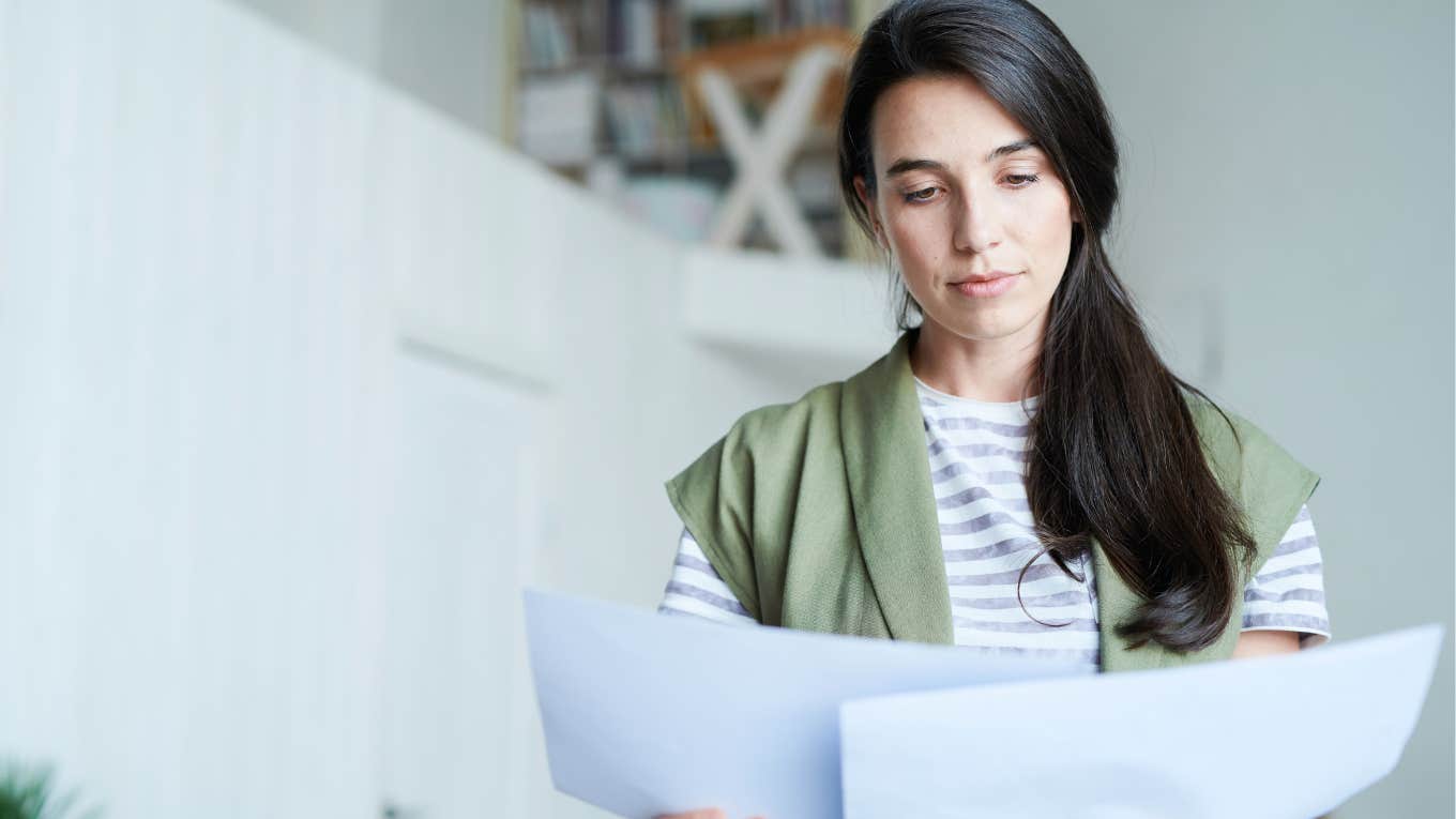 mom looking over teen daughter's assignment on ancient Greece