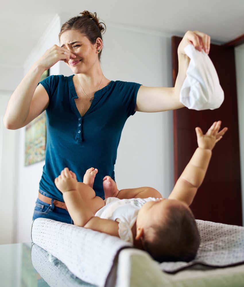 mom changing a stinky dirty diaper