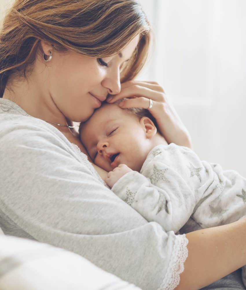 mom hugging newborn