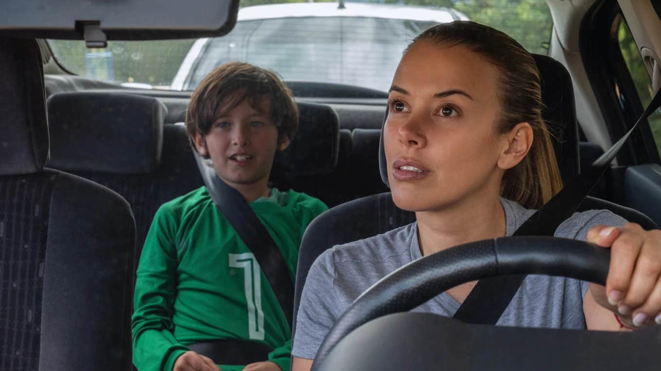 Mom having an uncomfortable conversation with her kid in the car