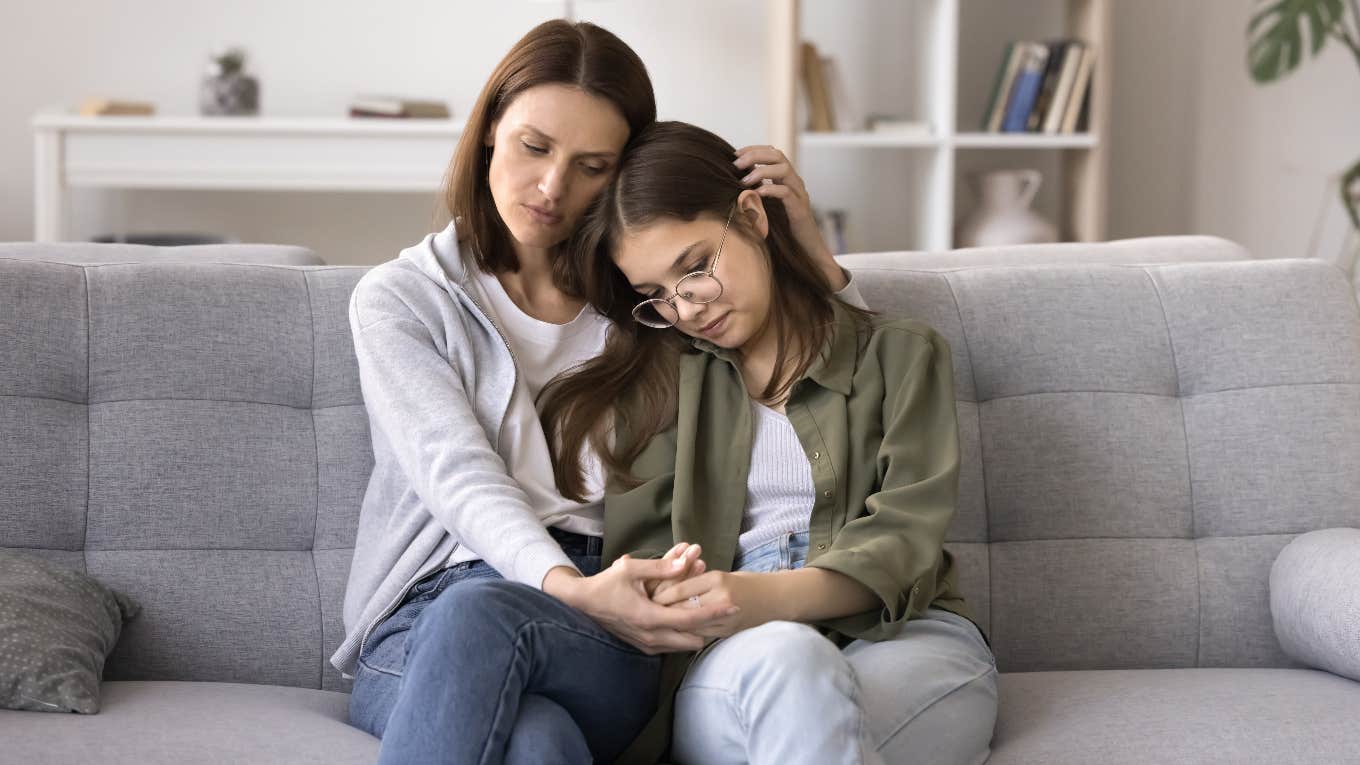 Mom comforting daughter