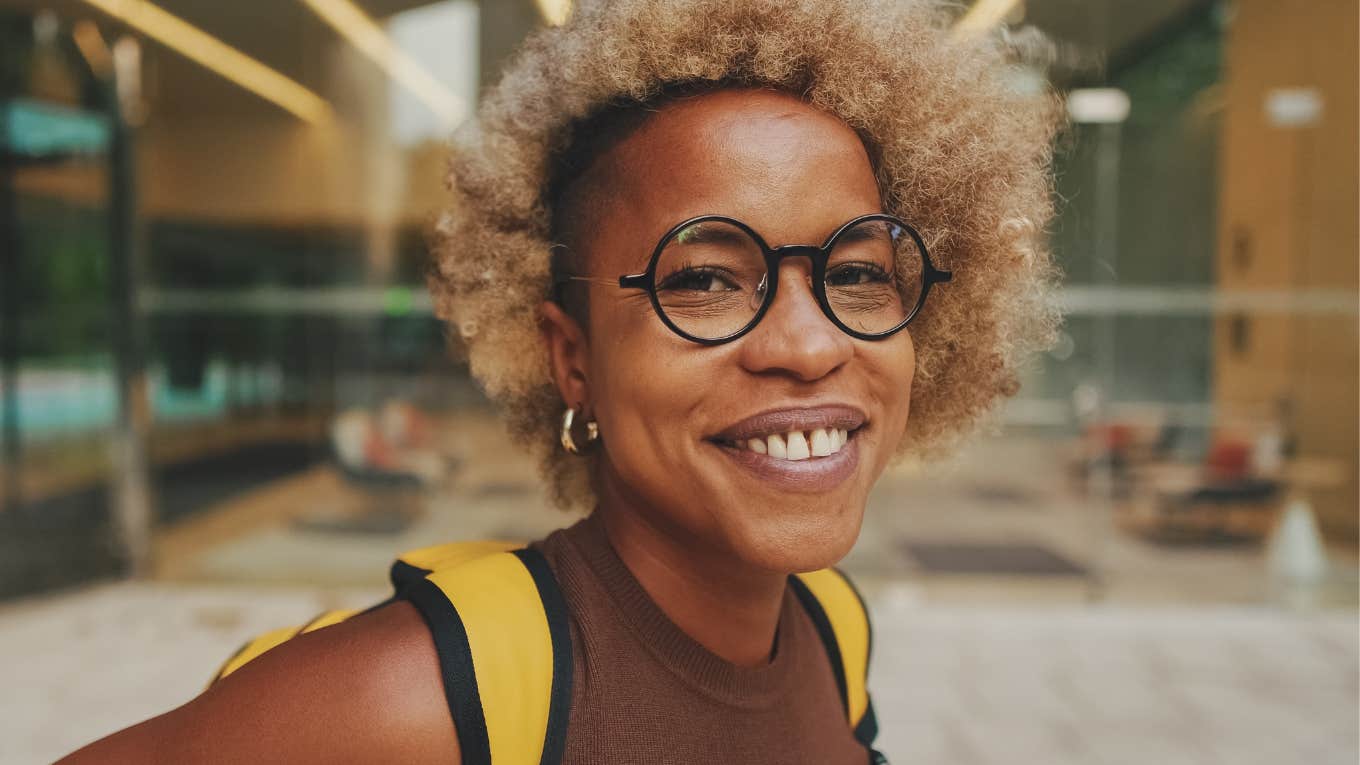 intelligent woman wearing glasses and smiling