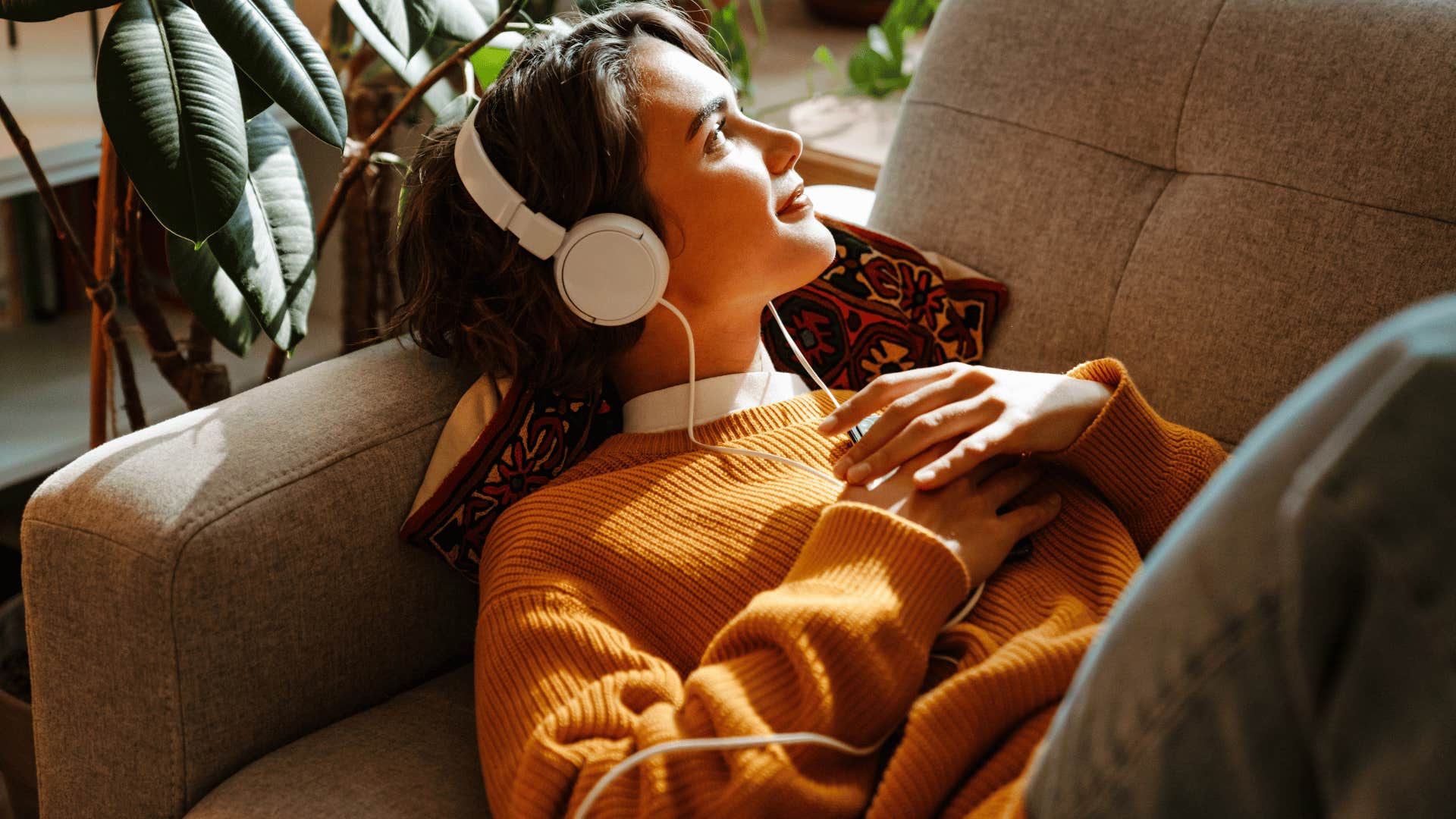 woman relaxing while listening to music 