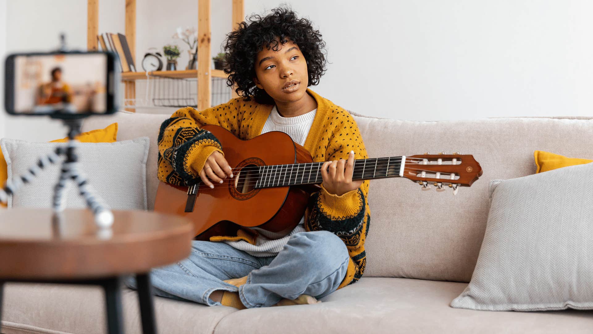 woman playing guitar