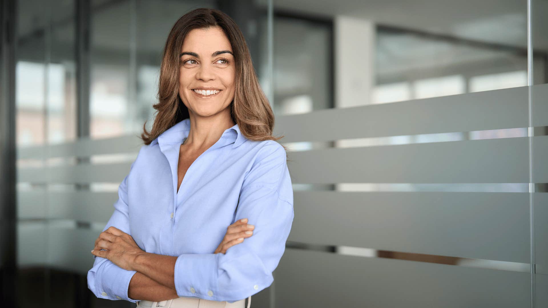 woman looking confident and crossing arms