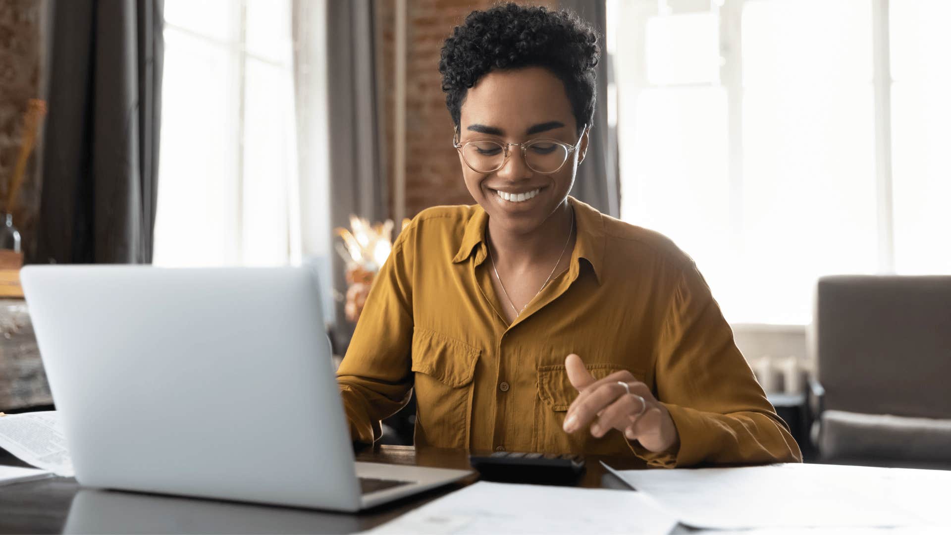 woman planning and using calculator 