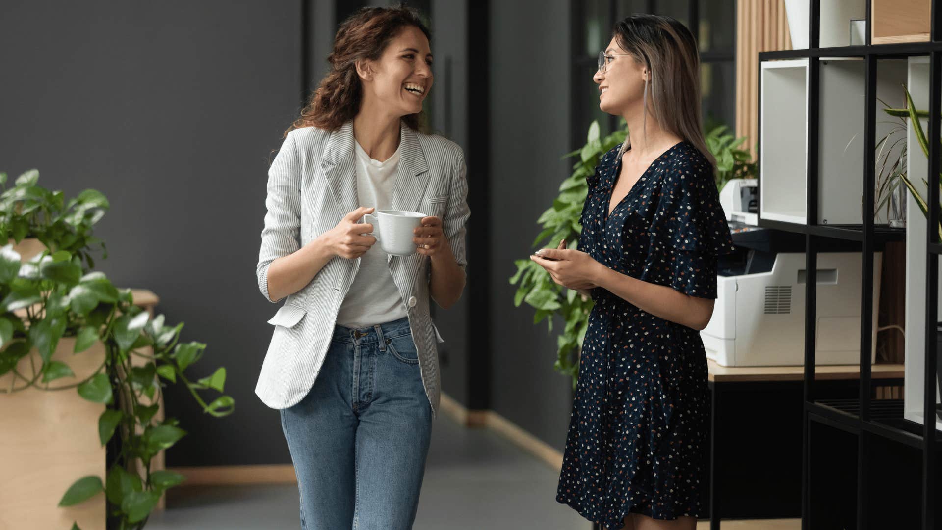 two women chatting at work