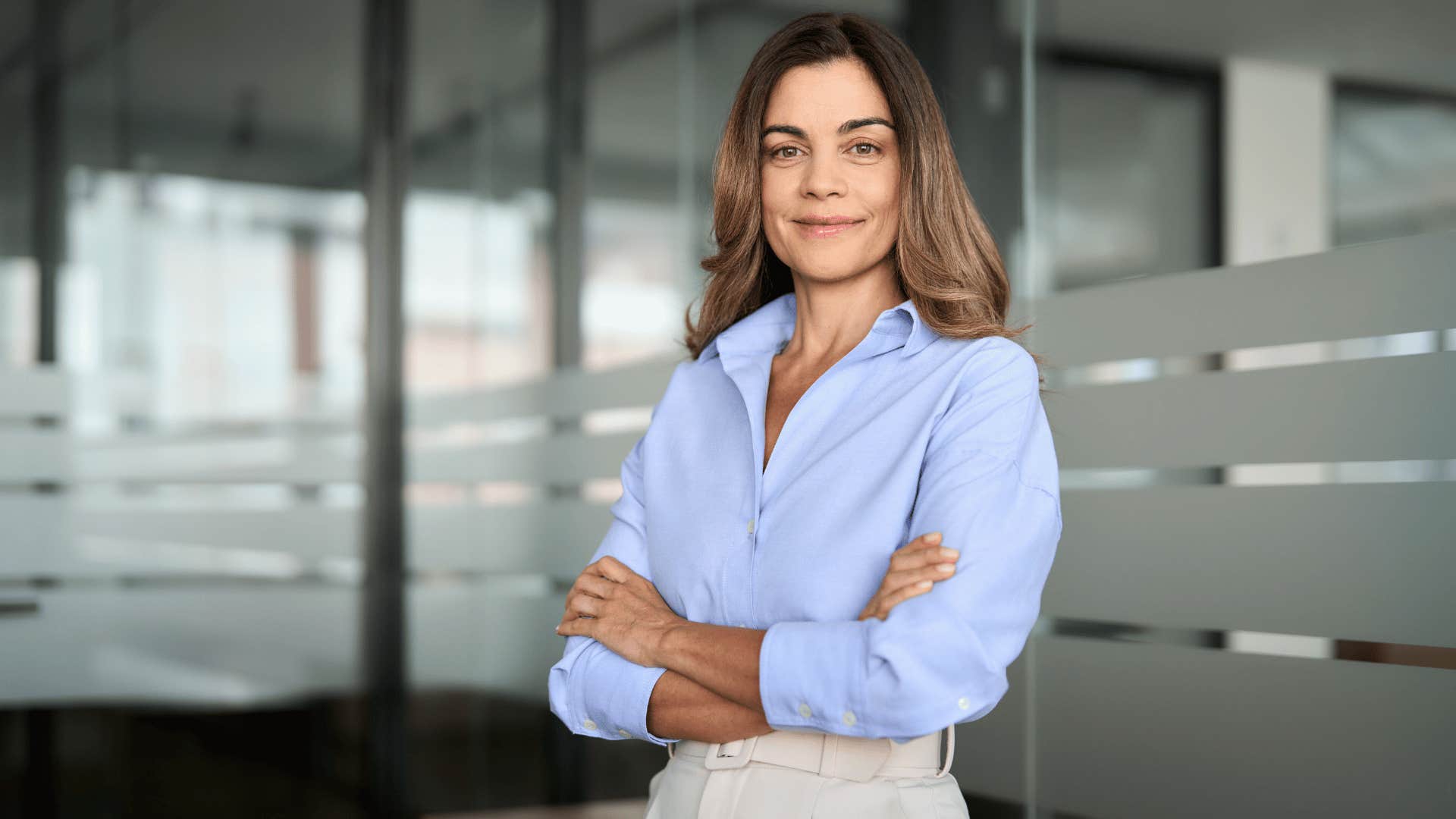 woman crossing her arms and looking confident 