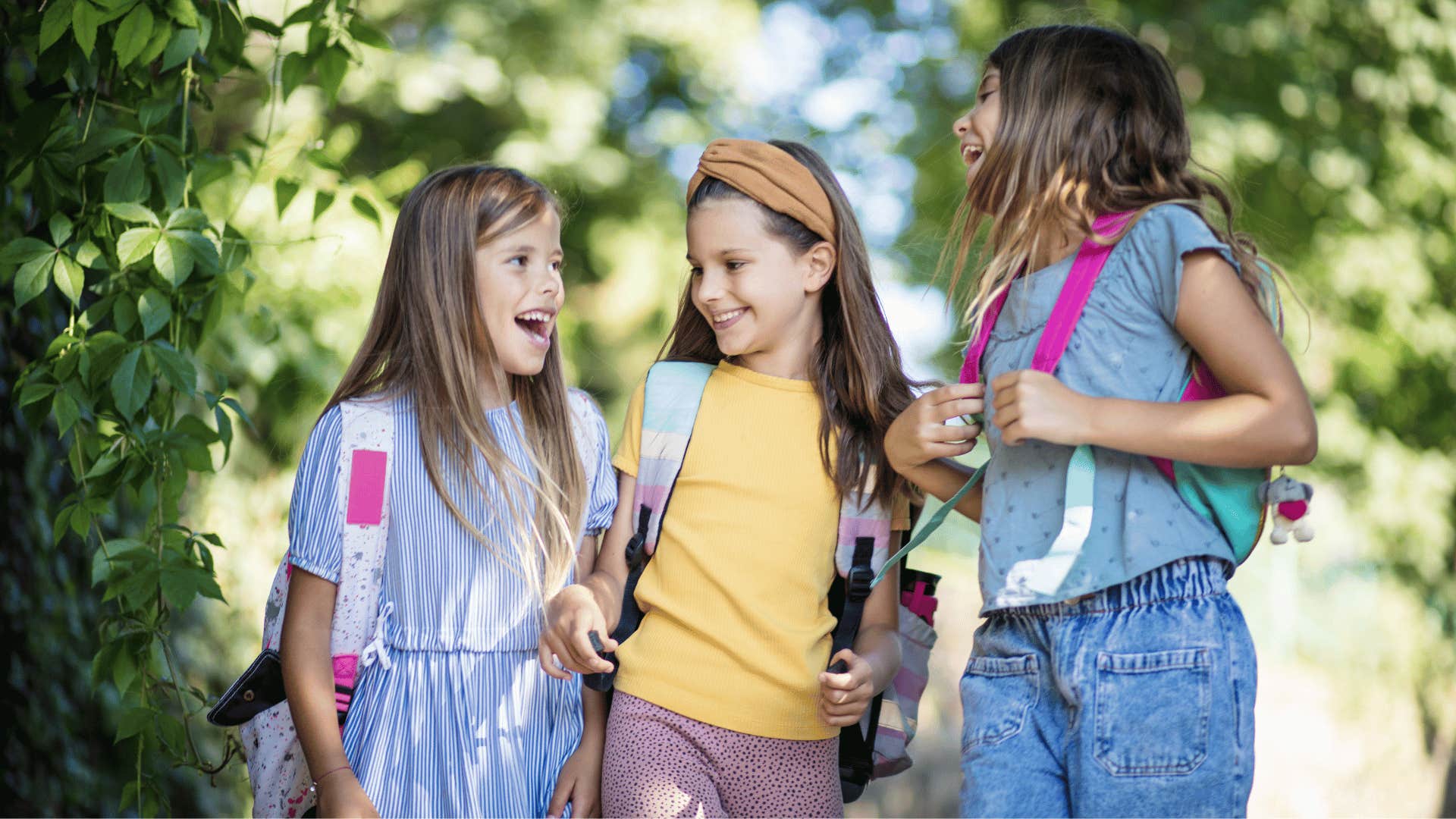 three young girls walking together