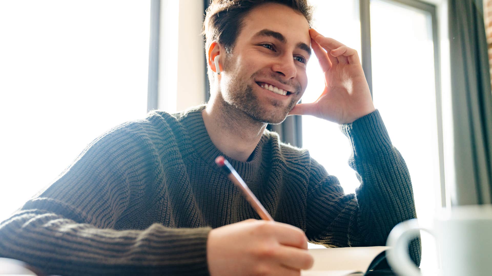 Gen Z man following old school manners of writing thank you notes