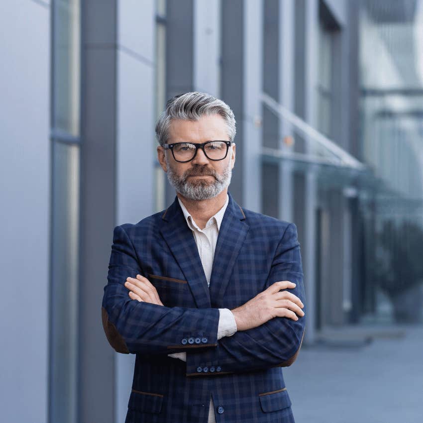 older businessman posing outdoors