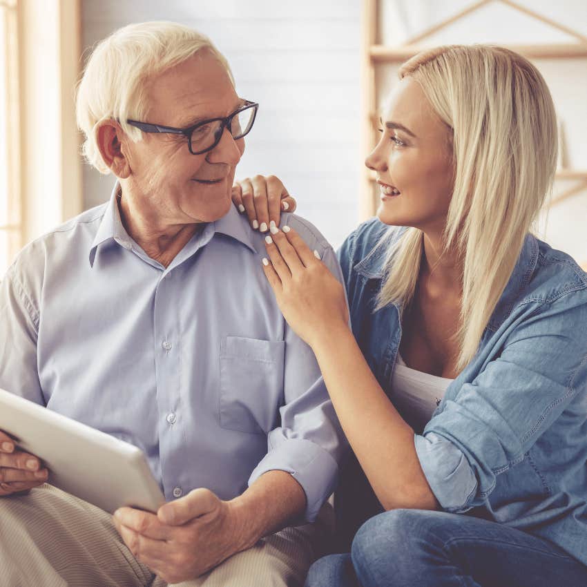 older man smiling at younger woman